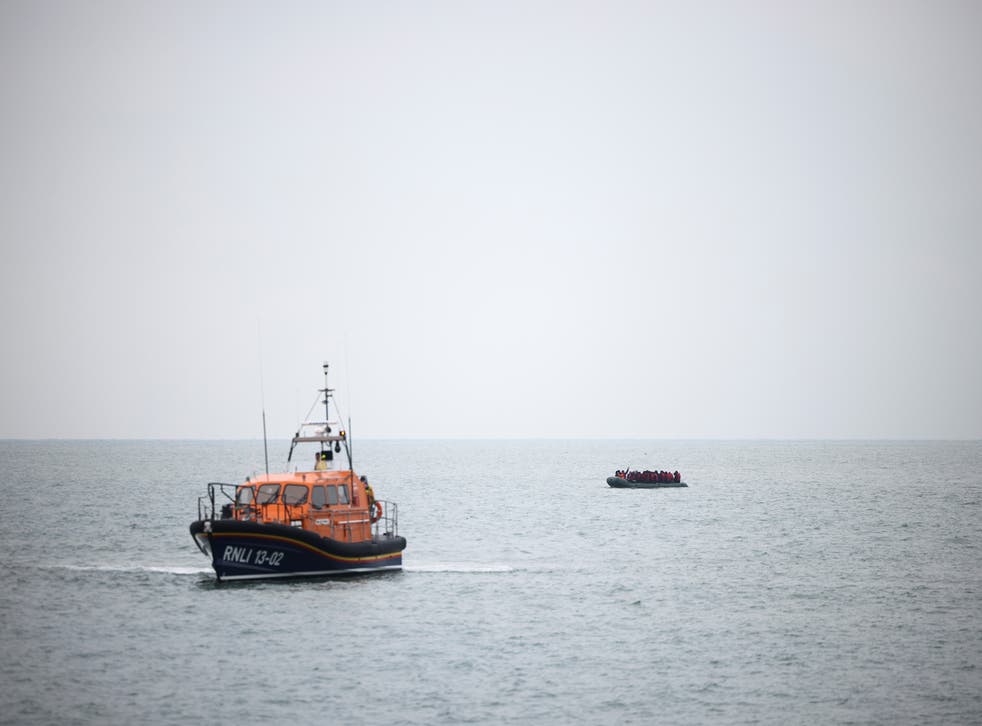 <p>Migrants are escorted ashore by a RNLI Lifeboat</p>