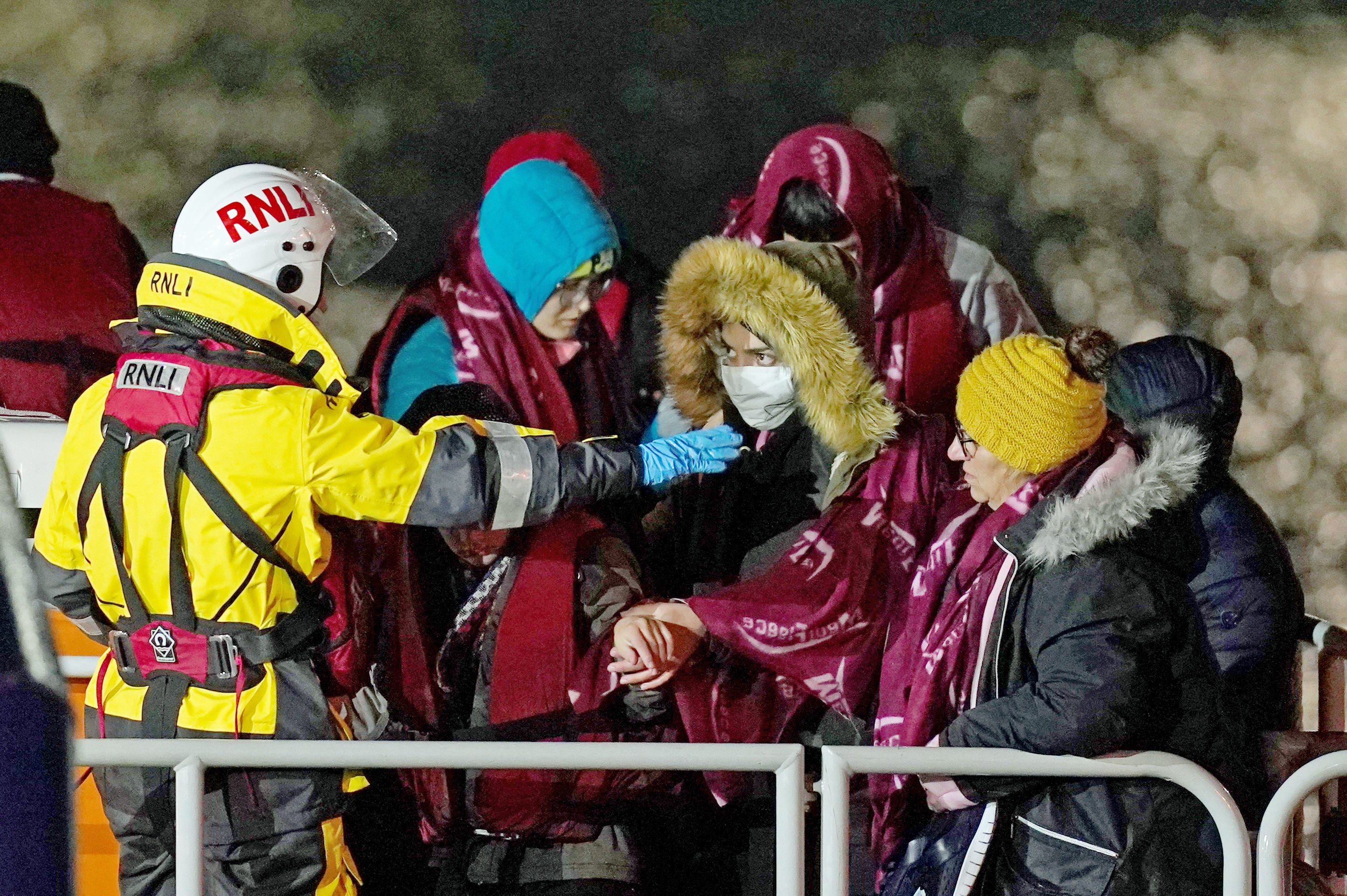 A group of people thought to be migrants are brought into Dover by the RNLI following a small boat incident in the Channel on Thursday