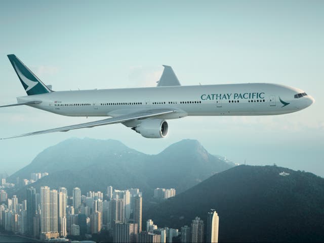<p>Cathay Pacific Boeing 777 above Hong Kong</p>