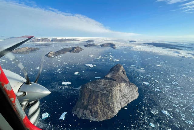 <p>Greenland’s melting ice sheet pictured from above </p>