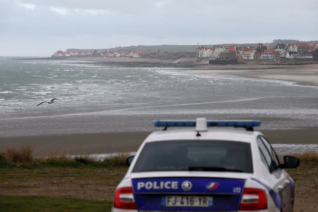 <p>French police patrol Wimereux, near Calais, the day after 27 migrants died attempting to cross the Channel </p>