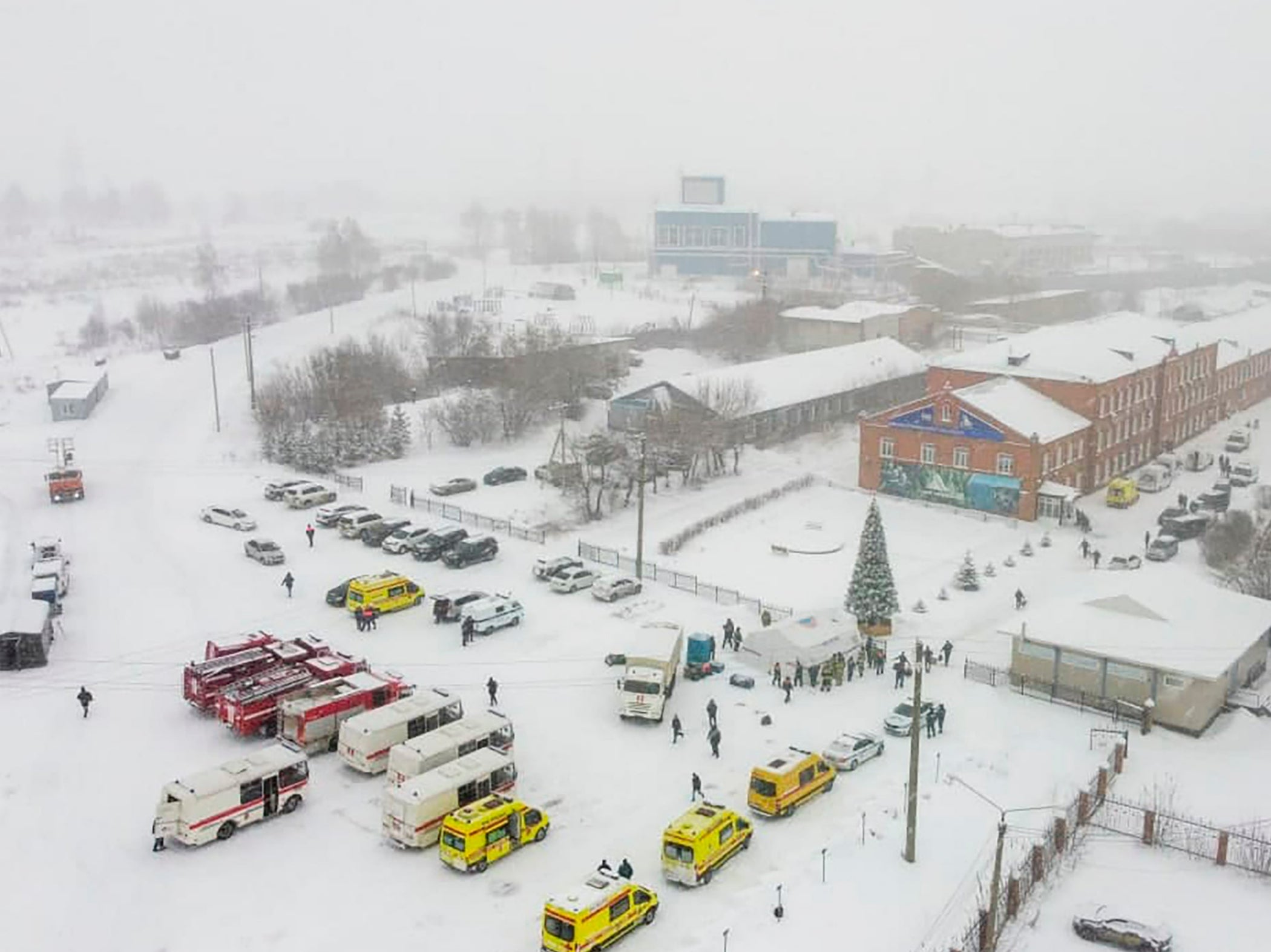 Ambulances and fire trucks are parked near the Listvyazhnaya coal mine