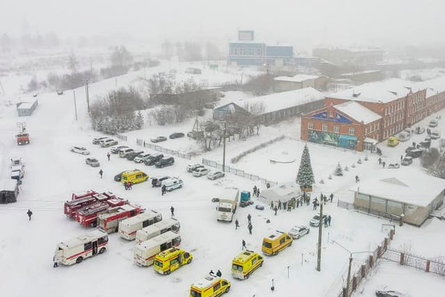 <p>Ambulances and fire trucks are parked near the Listvyazhnaya coal mine</p>