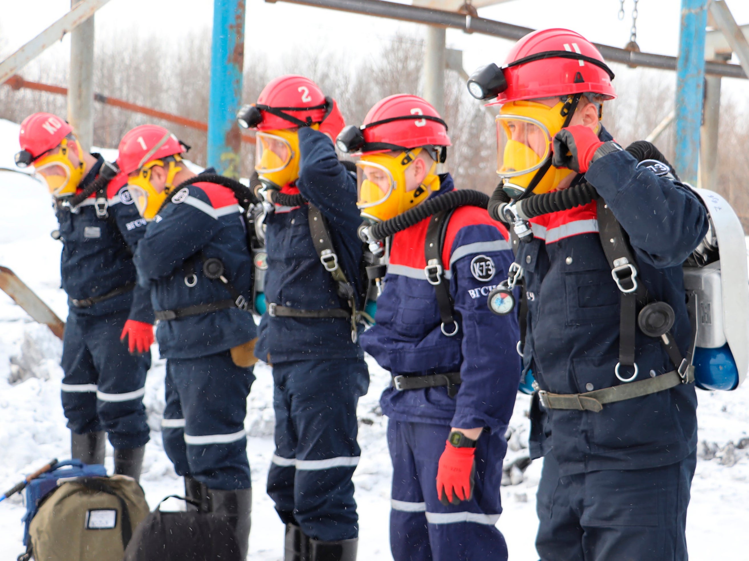 Rescuers prepare to work at a fire scene at a coal mine