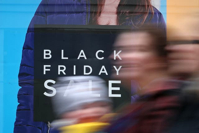 A shop displaying offer posters ahead of Black Friday sales (PA)
