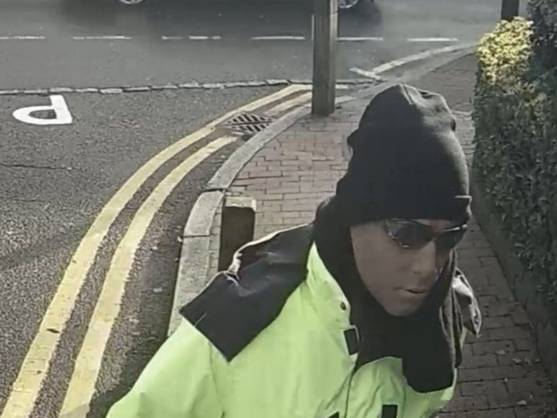 The clip shows a man wearing high-vis work clothes