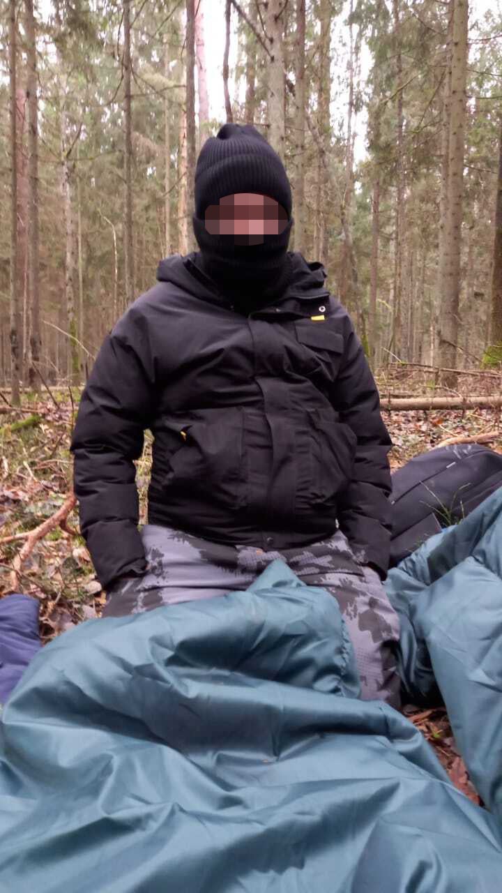 One of the people camped in the woods on the border