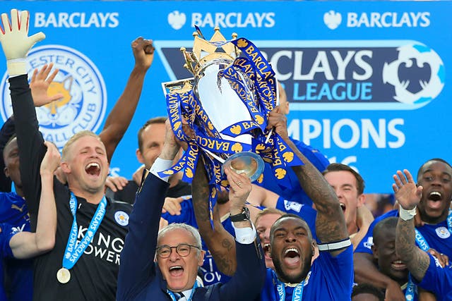 Leicester captain Wes Morgan and manager Claudio Ranieri lift the 2016 Premier League trophy (Nick Potts/PA)