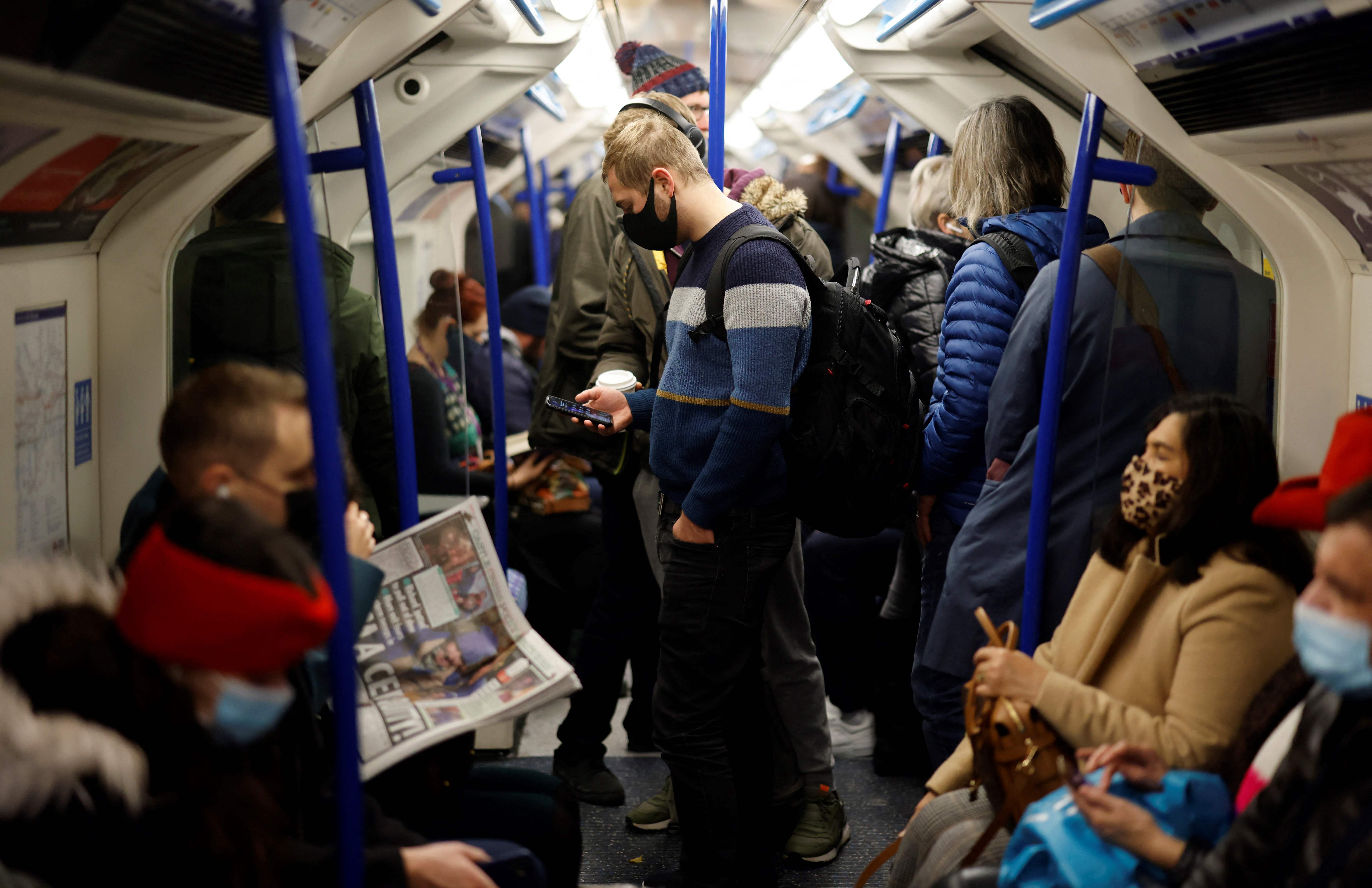 Commuters travel towards central London on a busy Victoria Line tube train