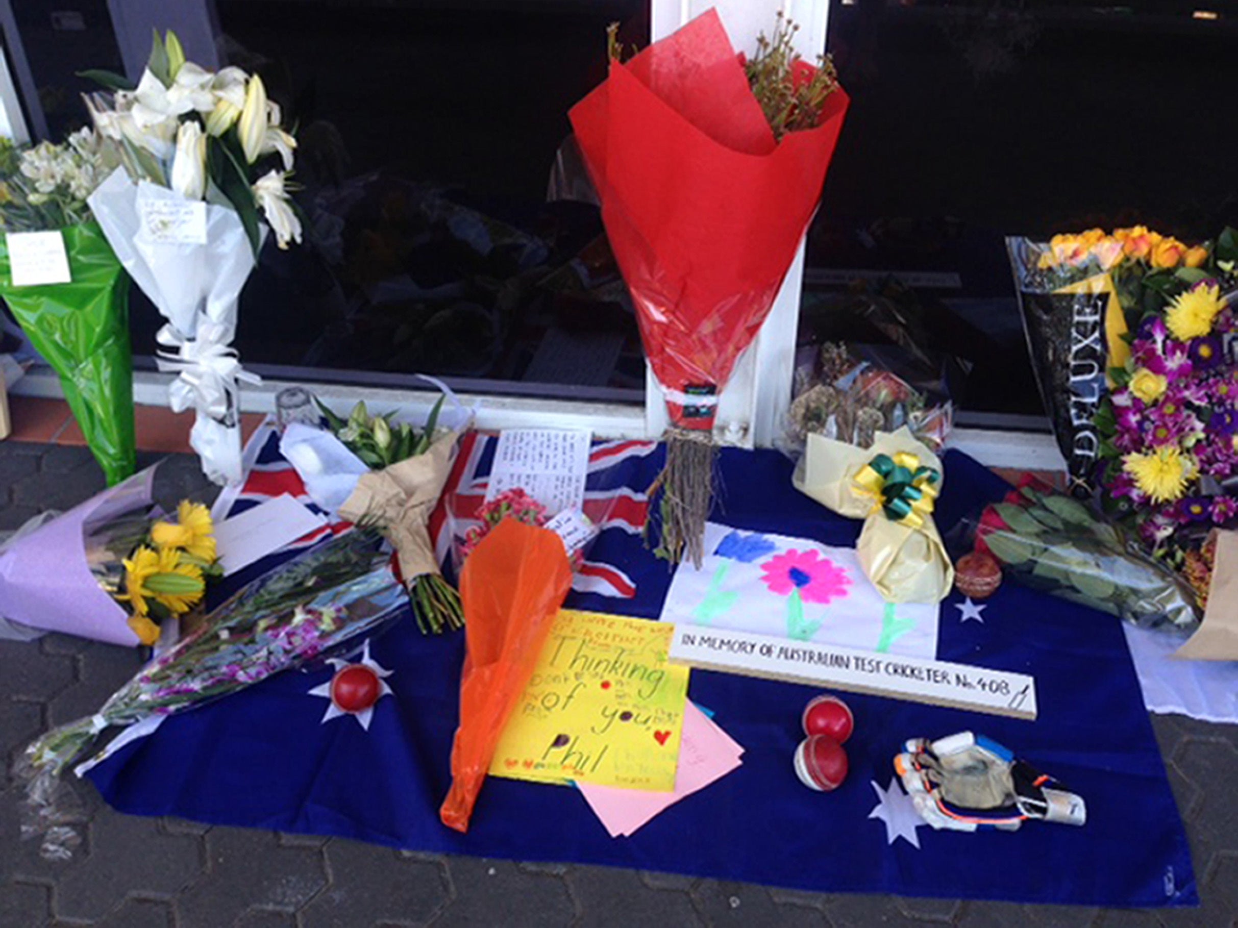 Tributes were left outside Sydney Cricket Ground in memory of Phillip Hughes (Jennifer Cockerall/PA)