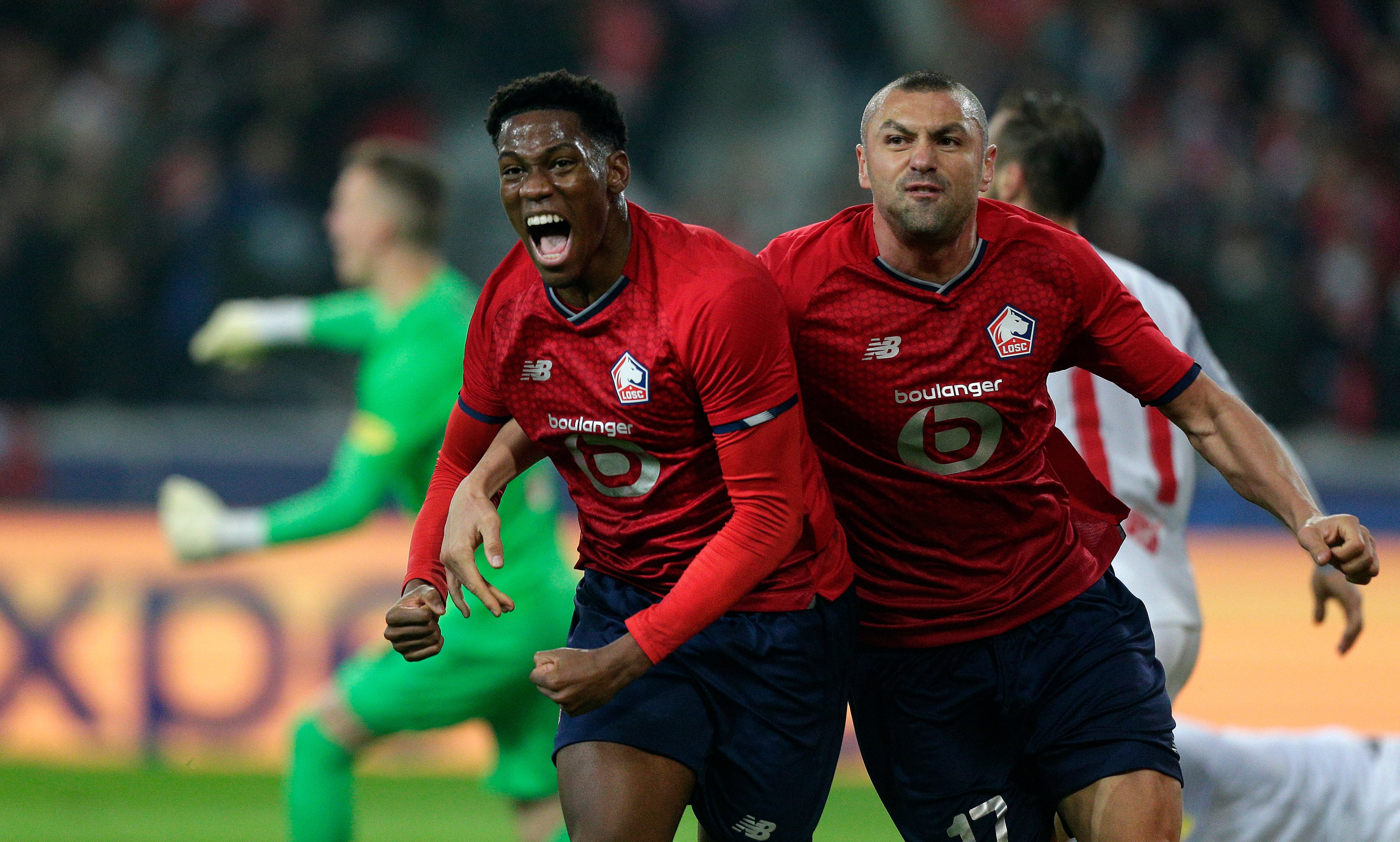 Burak Yilmaz (right) was on the score sheet again for Lille (Michel Spingler/AP/Press Association Images)