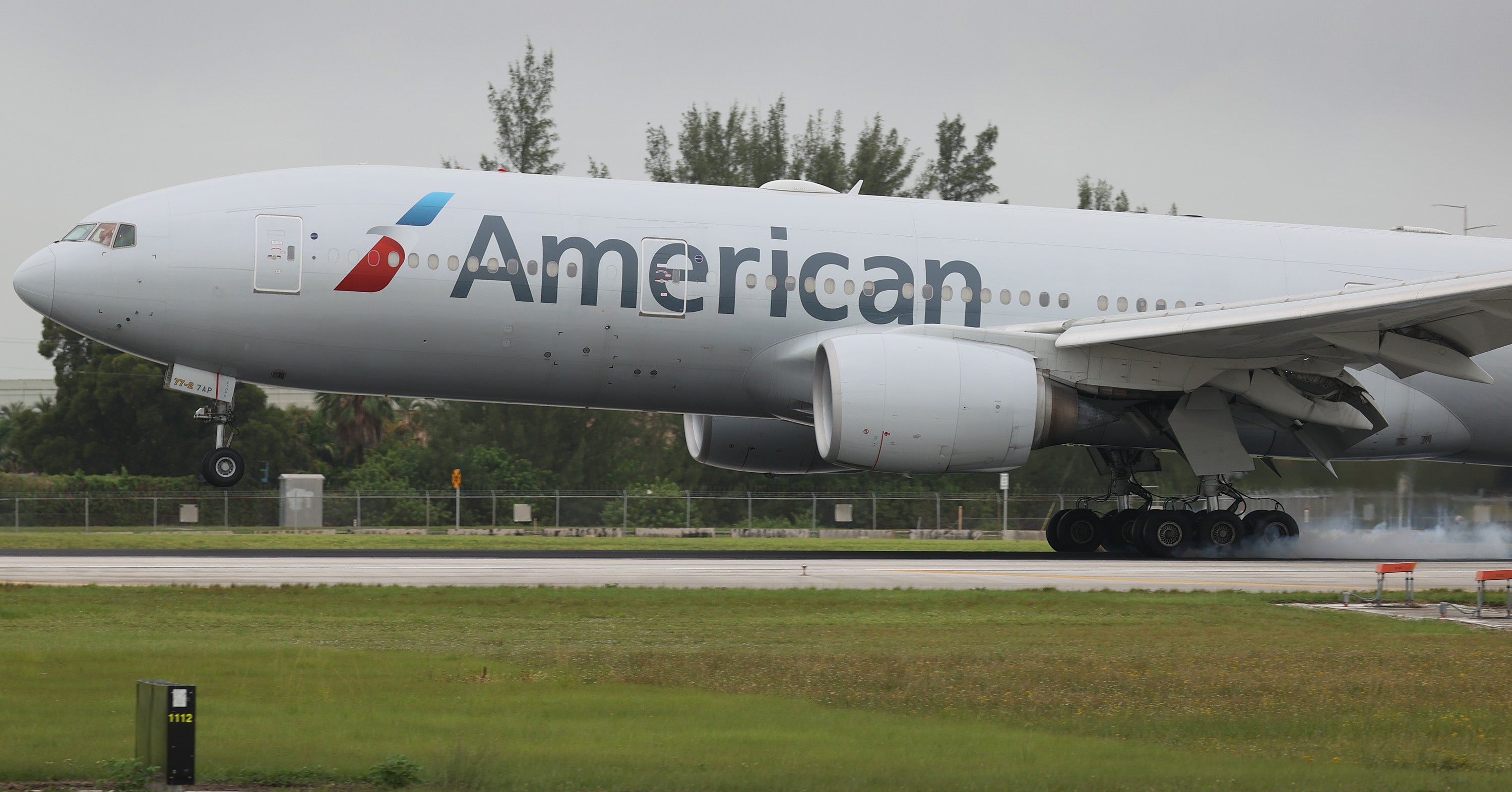 An American Airlines plane lands at the Miami International Airport. Since 1947, 129 people have attempted to stow away in commercial aeroplanes