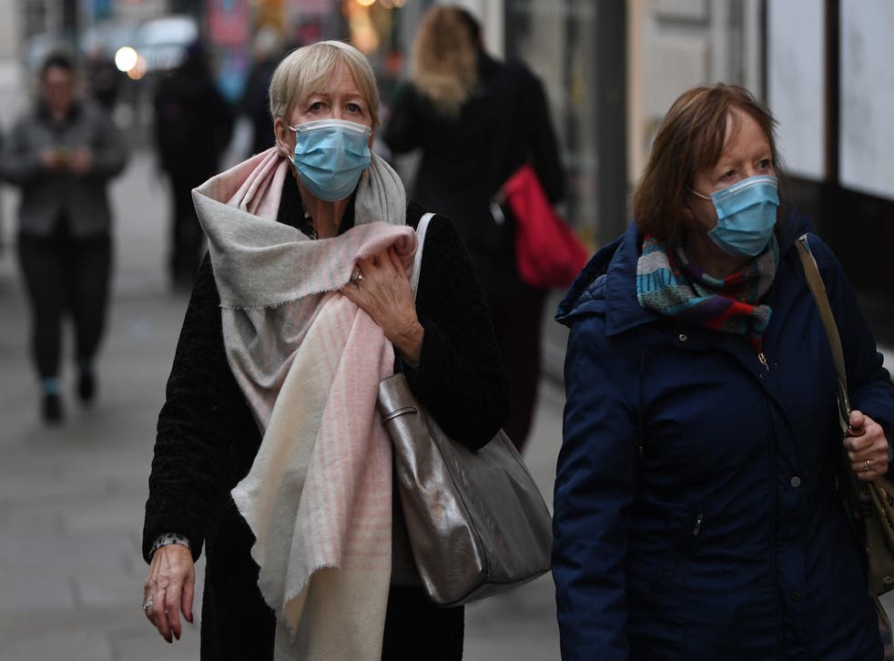 <p>Mask wearers on the streets of London this week </p>