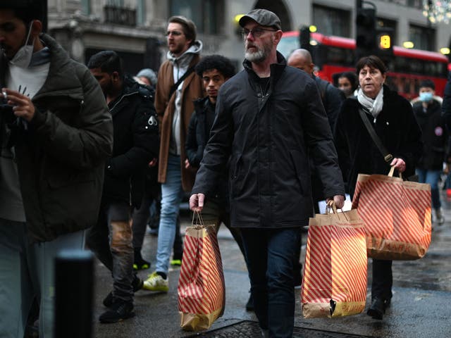 <p>Shoppers make their way along Oxford Street on Black Friday</p>