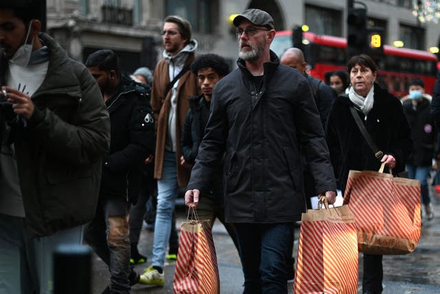 <p>Shoppers make their way along Oxford Street on Black Friday</p>