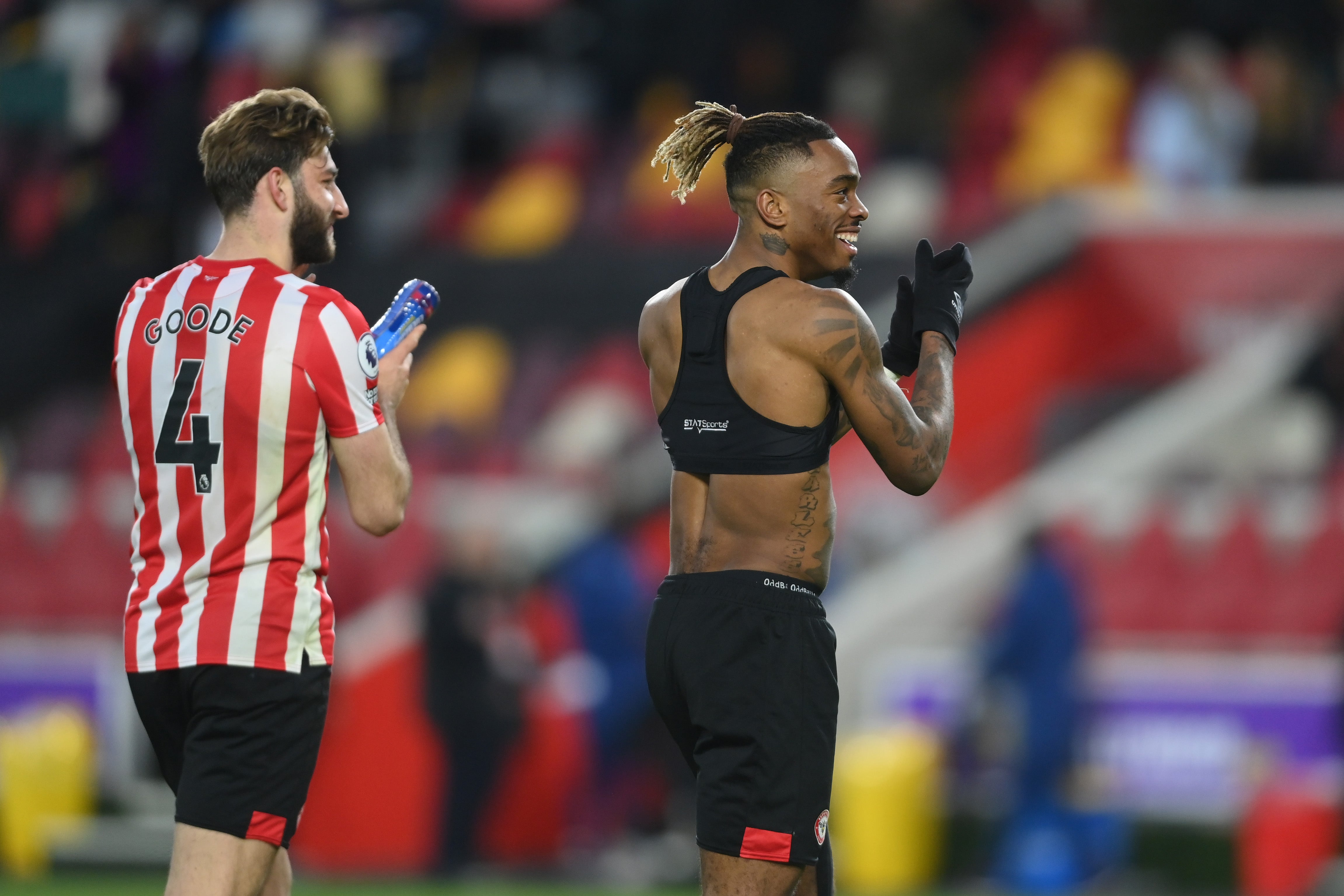 Ivan Toney and Charlie Goode of Brentford applaud the fans