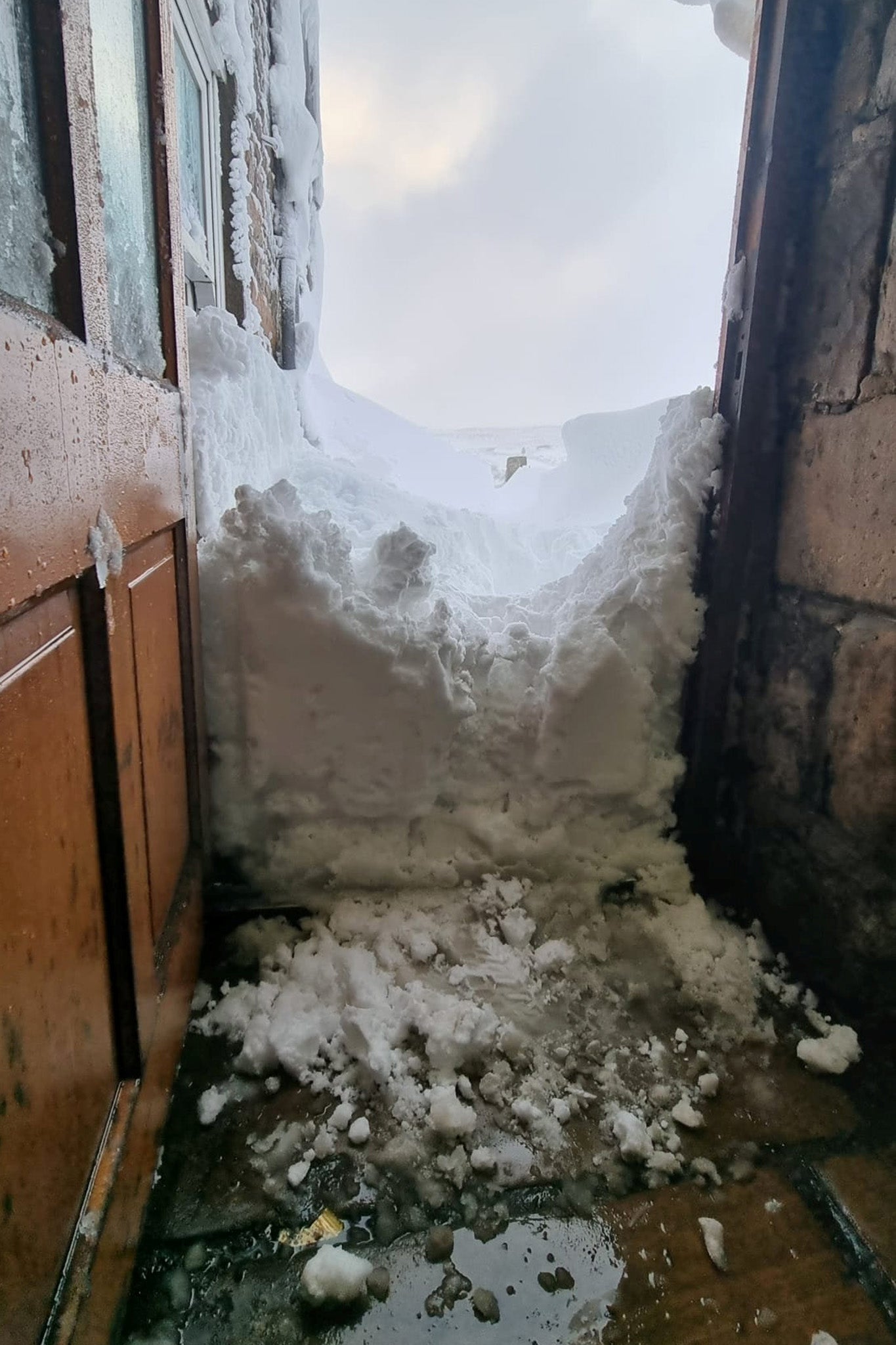 The inn has been buried in enormous snowdrifts