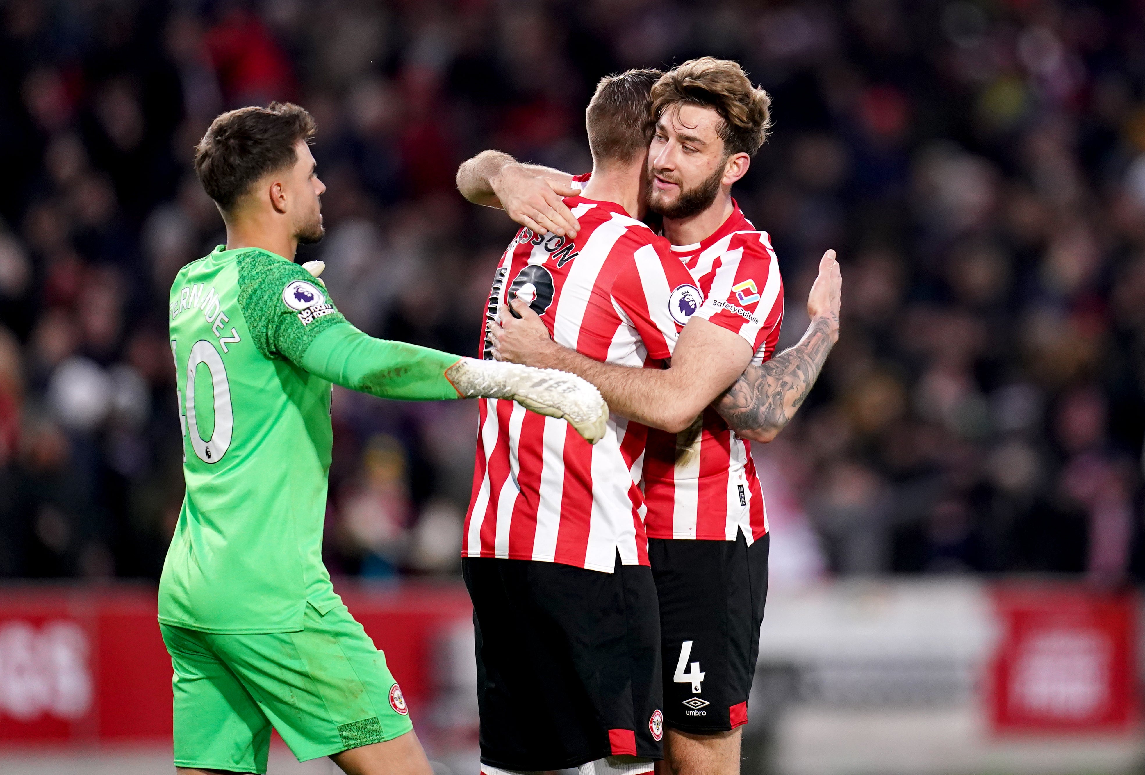 Brentford celebrate at the final whistle (John Walton/PA)