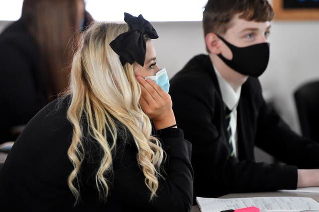 <p>Pupils at Copley Academy, in Manchester, wear face masks in class</p>