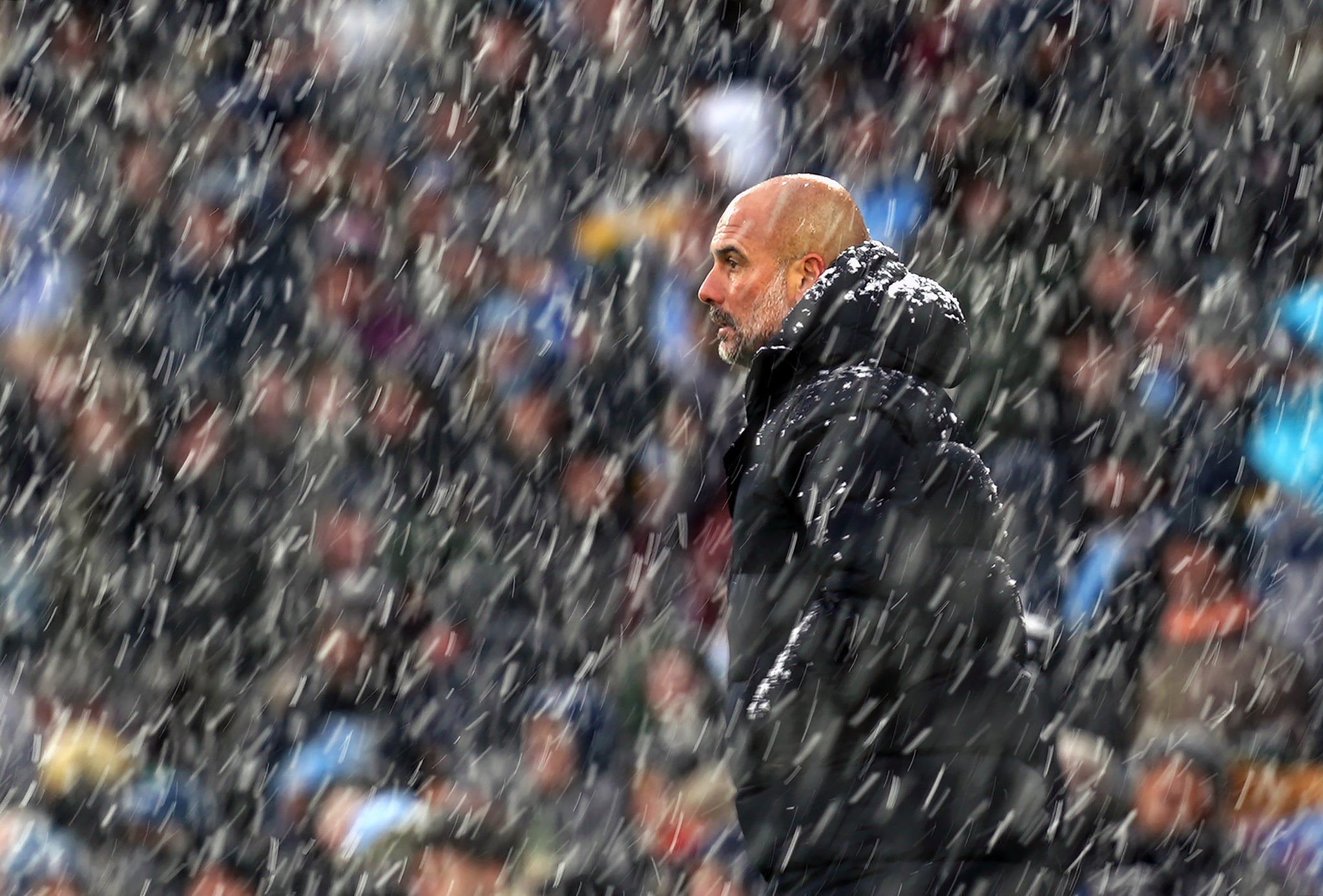 Manchester City manager Pep Guardiola saw his side brave the elements to beat West Ham 2-1 at a snowy Etihad Stadium, which cut Chelsea’s lead down to a point (Martin Rickett/PA)