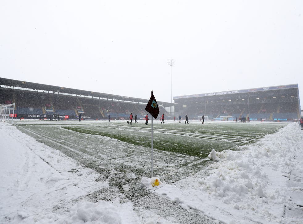 Despite the best efforts of ground staff at Turf Moor, Burnley’s game with Tottenham was called off (Bradley Collyer/PA)