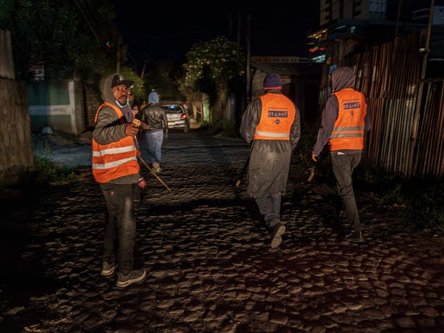 <p>Volunteers conduct a night patrol in Addis Ababa</p>