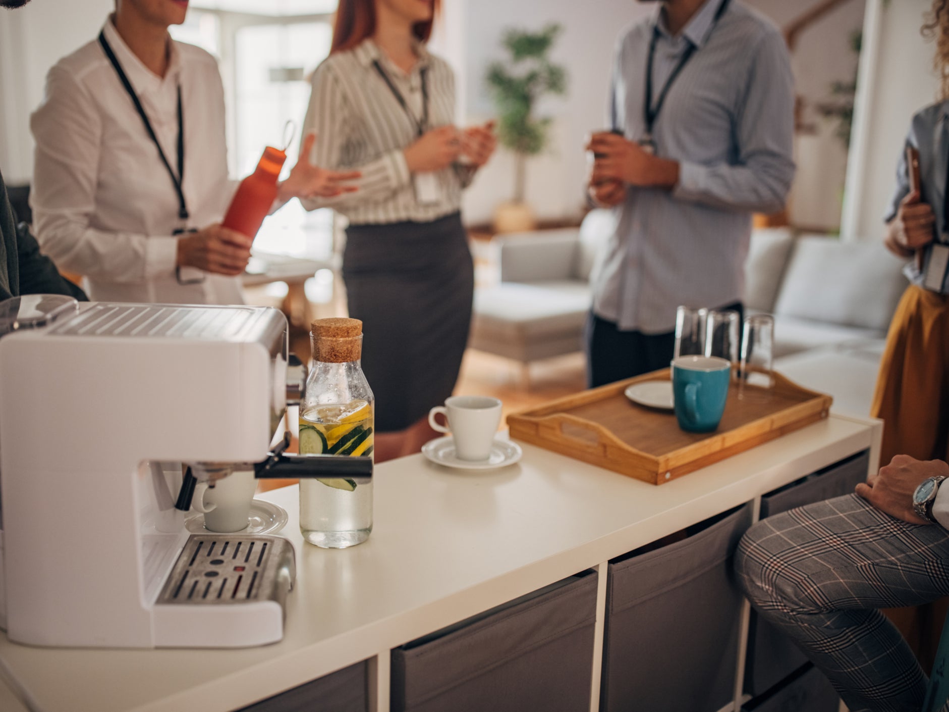 A group of people take a coffee break at work