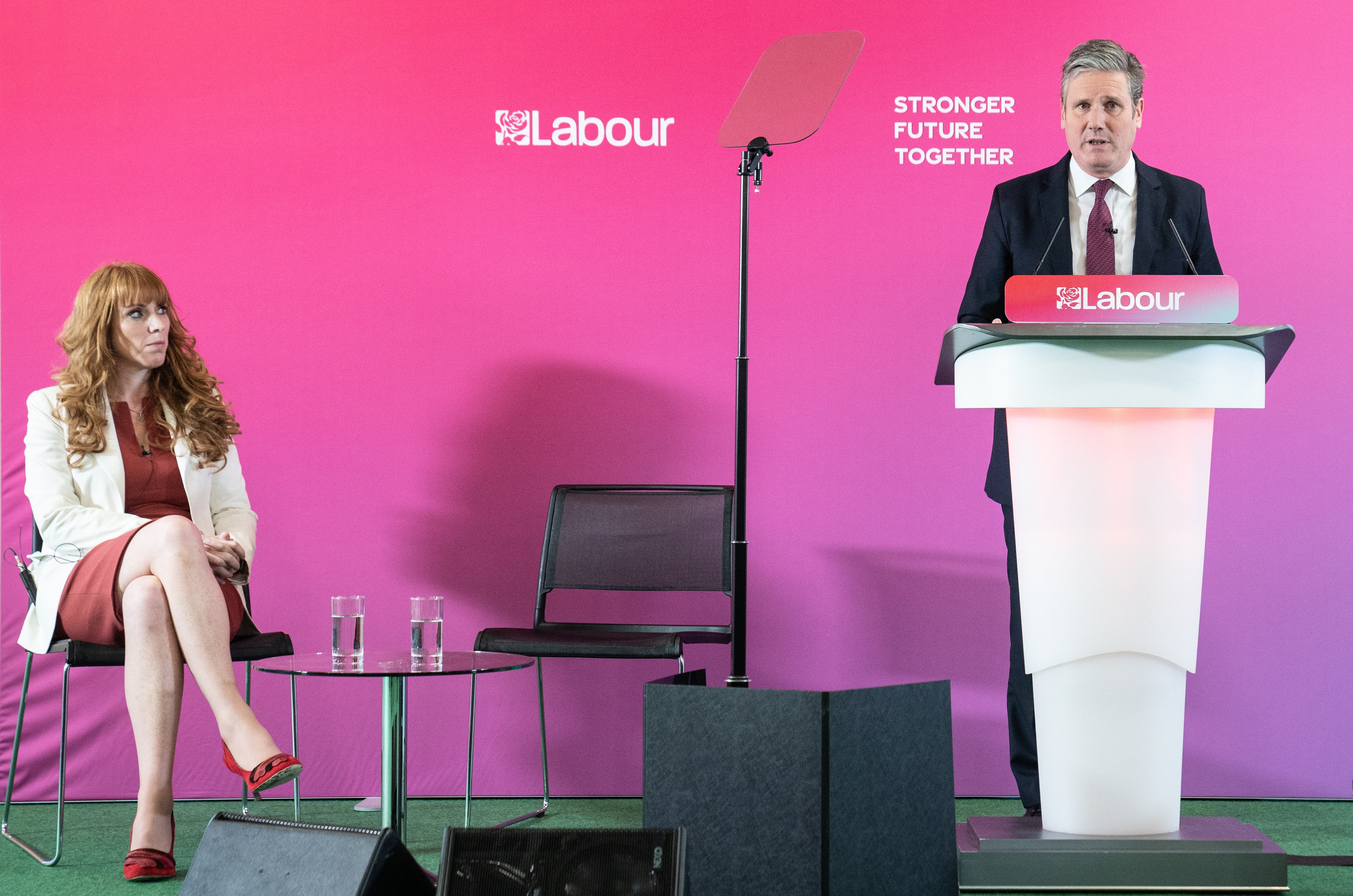 <p>Labour deputy leader Angela Rayner listens as Labour leader Keir Starmer gives a speech </p>