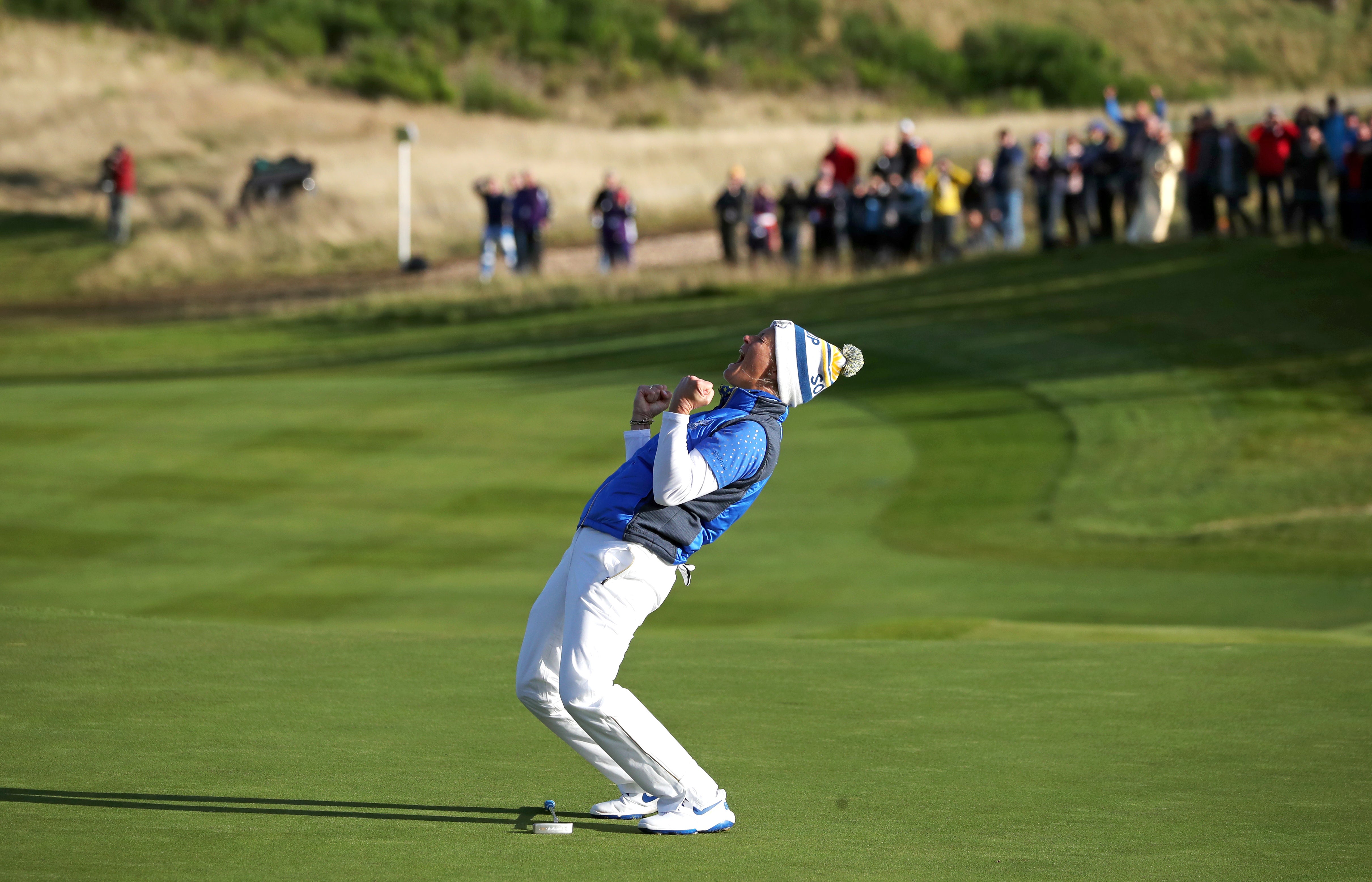 Suzann Pettersen celebrates her putt on the 18th to win the Solheim Cup for Europe (Jane Barlow/PA)