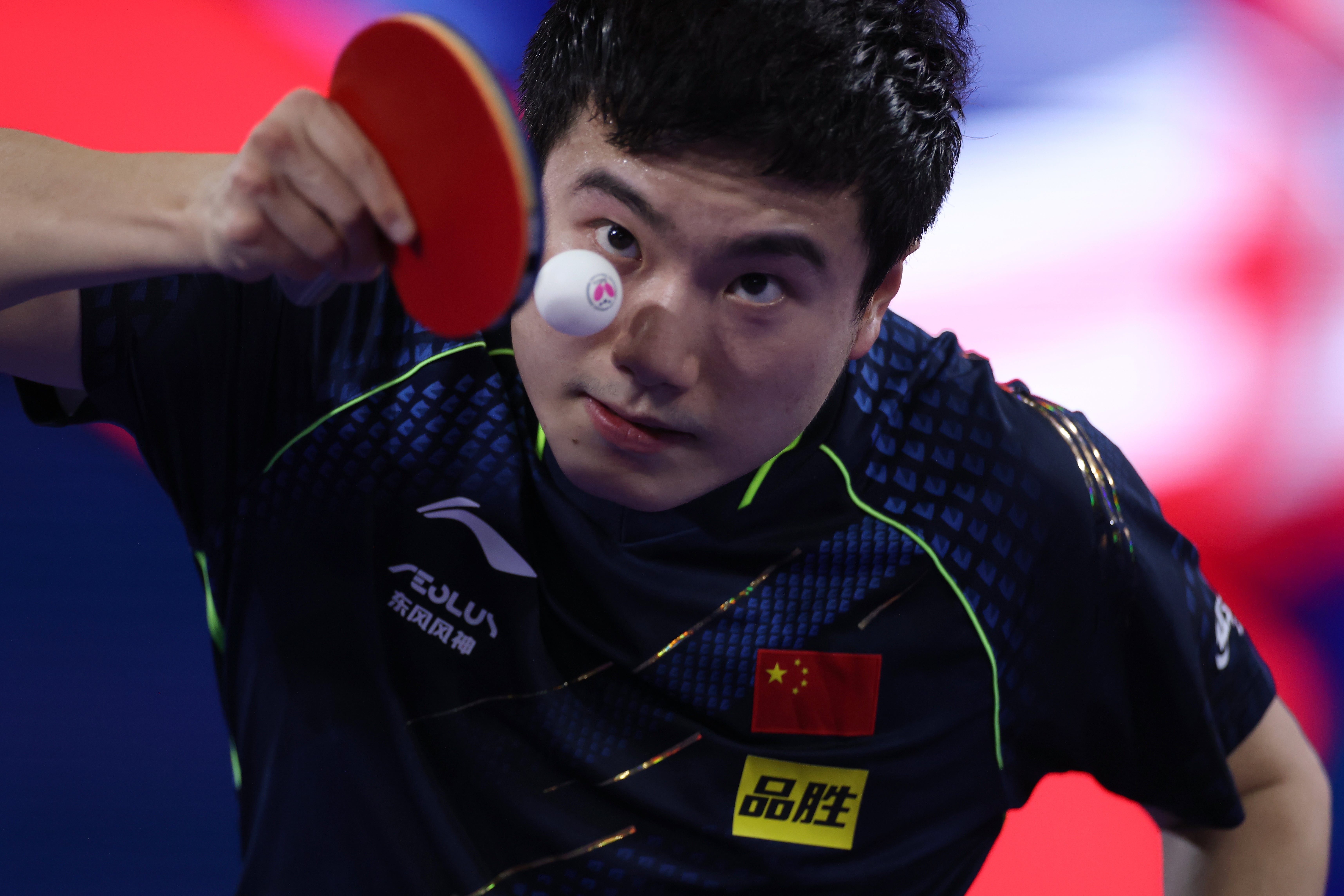 Liang Jingkun serves to Fan Zhendong during the men’s singles semi-finals