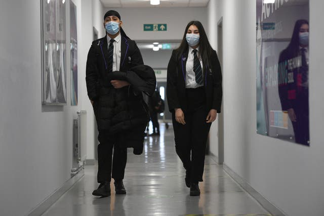 Face masks should be worn in communal areas in schools and colleges under new guidance (Kirsty O’Connor/PA)