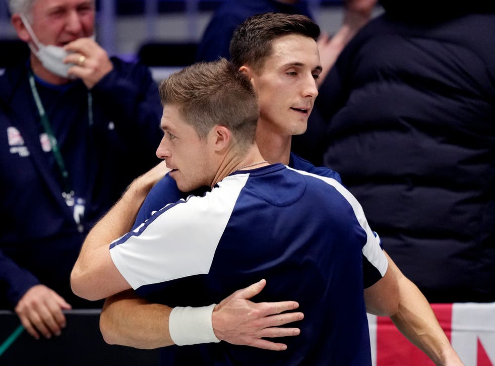Joe Salisbury, right, and Neal Skupski celebrate after booking Britain’s spot in the quarter-finals (Michael Probst/AP)