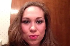 Pregnant librarian killed after pulling gun on motorcyclist in road rage row