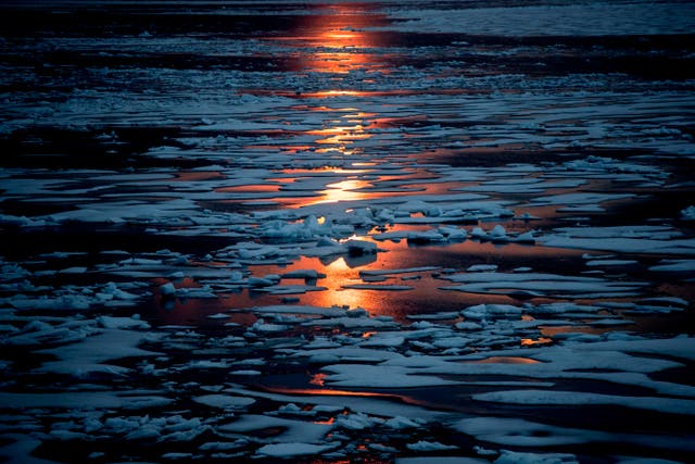 <p>The midnight sun shines across sea ice along the Northwest Passage in the Canadian Arctic Archipelago in July 2017</p>