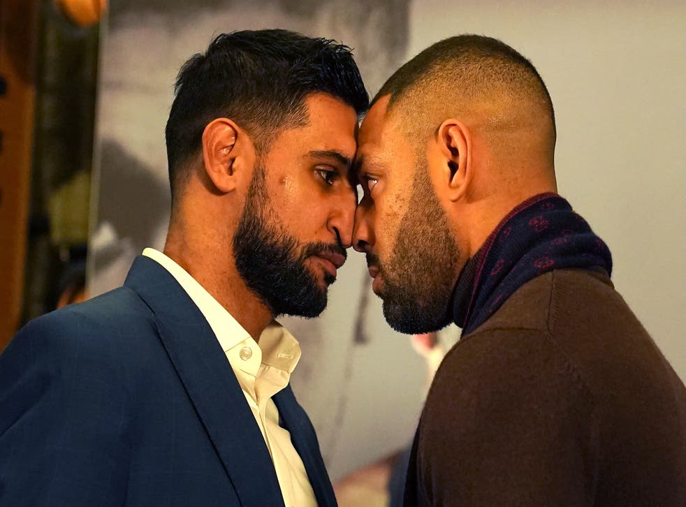 <p>Amir Khan (left) and Kell Brook confront each other during a press conference</p>