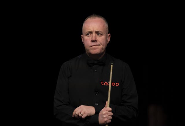 John Higgins suffered a first-round defeat (Tim Goode/PA)