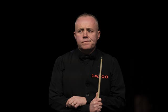 John Higgins suffered a first-round defeat (Tim Goode/PA)