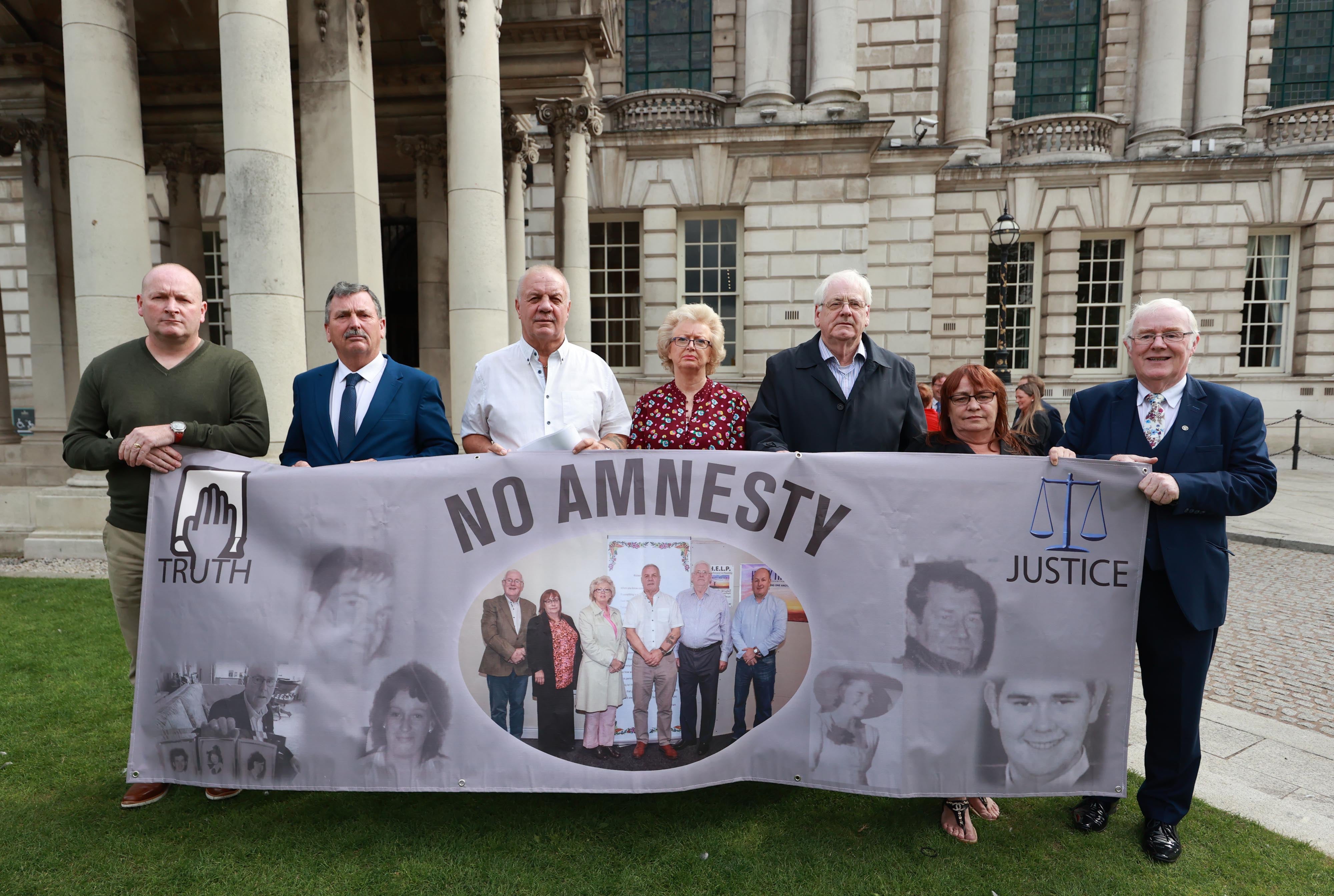 (left to right) Billy McManus , John Teggart, Raymond McCord, Julie Hambleton, Michael Gallagher, Cathy McIlvenny and Eugene Reavey campaign against an amnesty (Liam McBurney/PA)