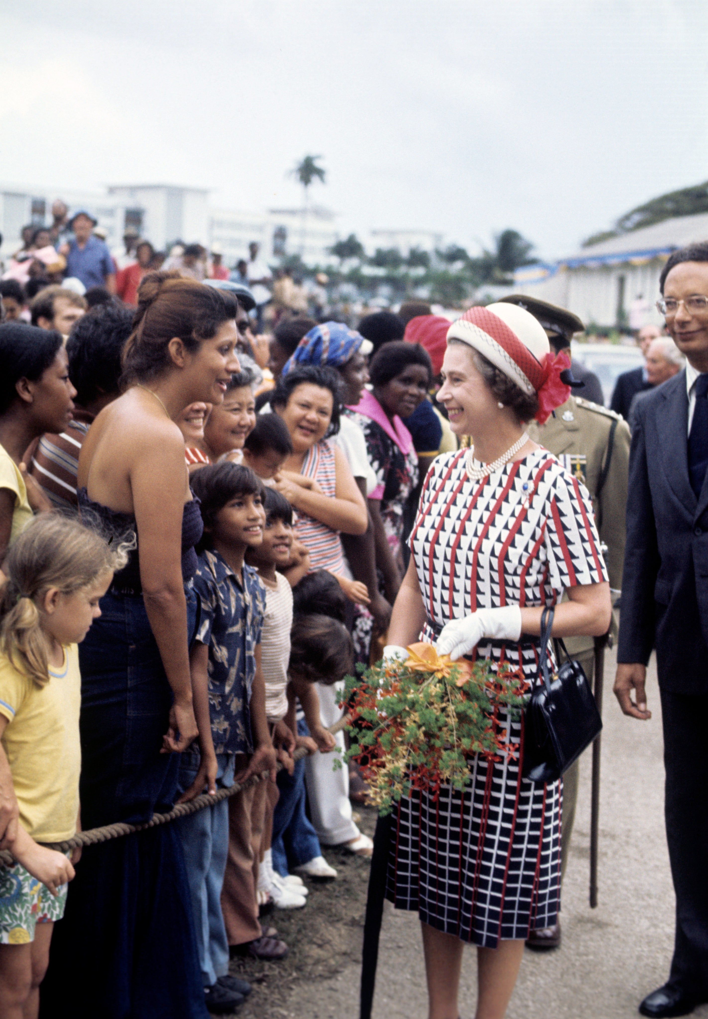 The Queen during a walkabout in Bridgetown, Barbados, during her silver jubilee tour of the Caribbean (Ron Bell/PA)
