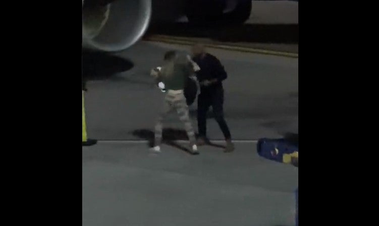 <p>Woman resists police who try to restrain her</p>