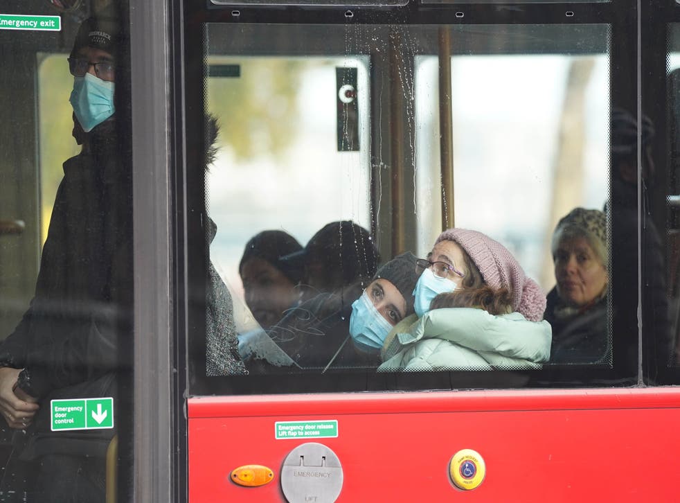 Face coverings are once again compulsory on public transport in England (Stefan Rousseau/PA)