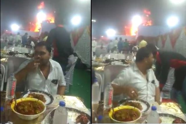 <p>Two men were busy enjoying delicacies while a portion of the venue burned down</p>