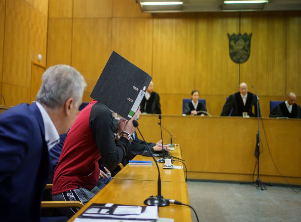 <p>Iraqi Taha Al-J takes his seat in the dock before the verdict is handed down in Frankfurt, Germany</p>
