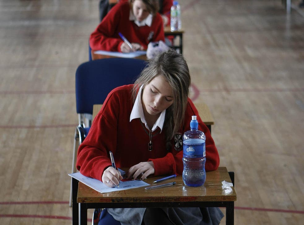 Students sit an exam in a Dublin school (Niall Carson/PA)