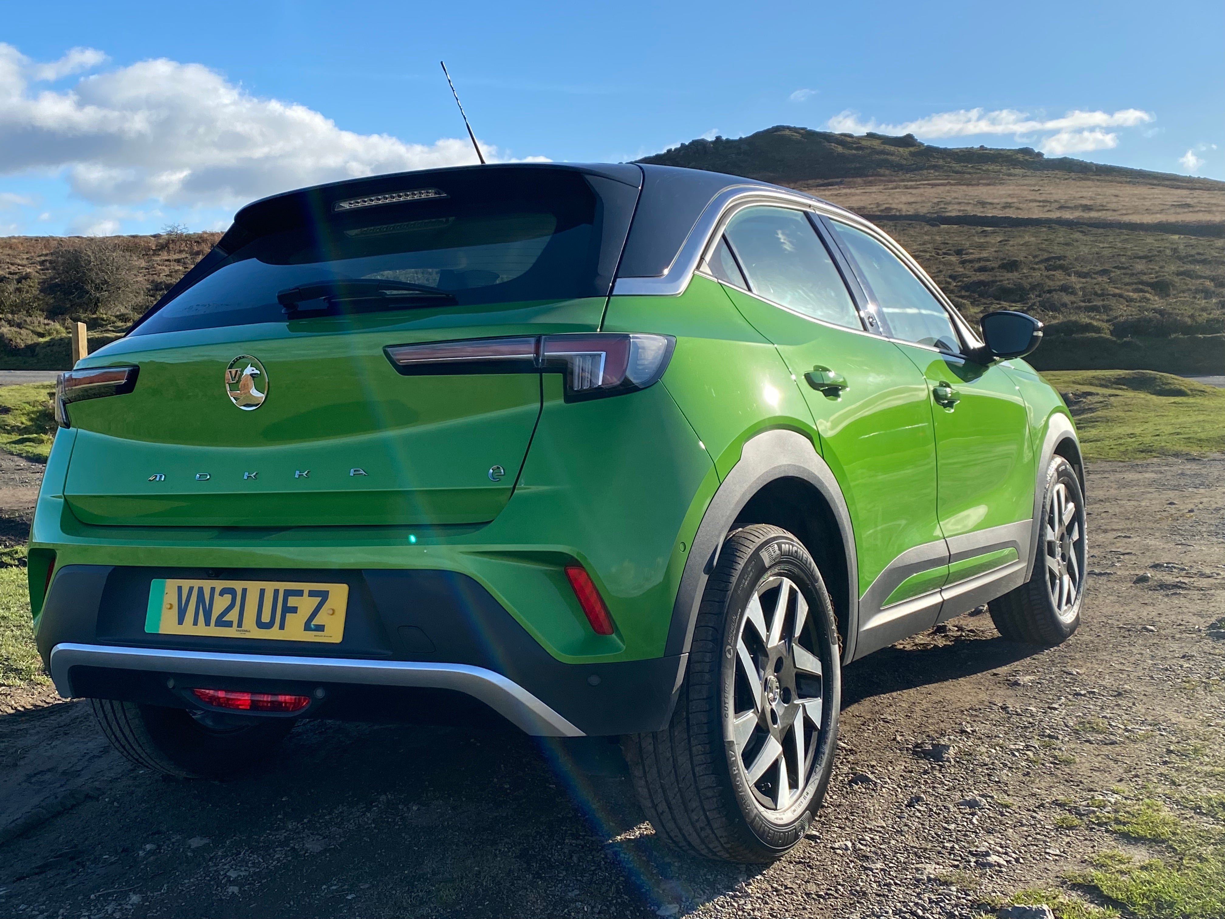 The new all-electric Vauxhall Mokka-e shines amid Dartmoor’s dramatic landscape.