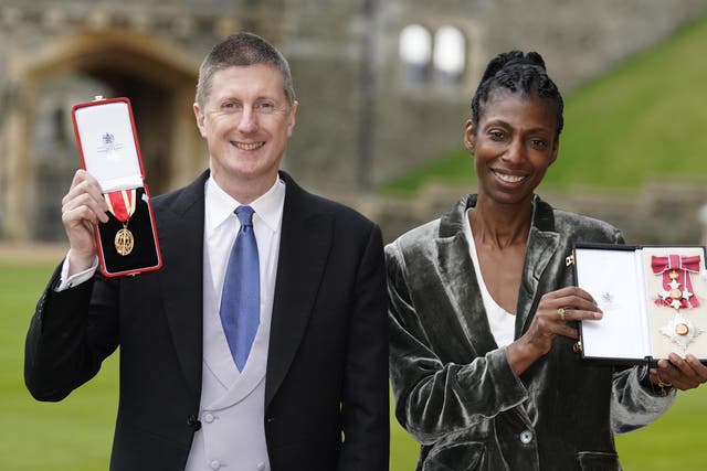 Dame Sharon White and her husband Sir Robert Chote with the awards they received at an investiture ceremony at Windsor Castle (Andrew Matthews/PA)