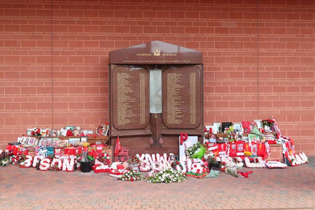 Flowers and tributes left at the Hillsborough Memorial outside Anfield stadium (Peter Byrne/PA)