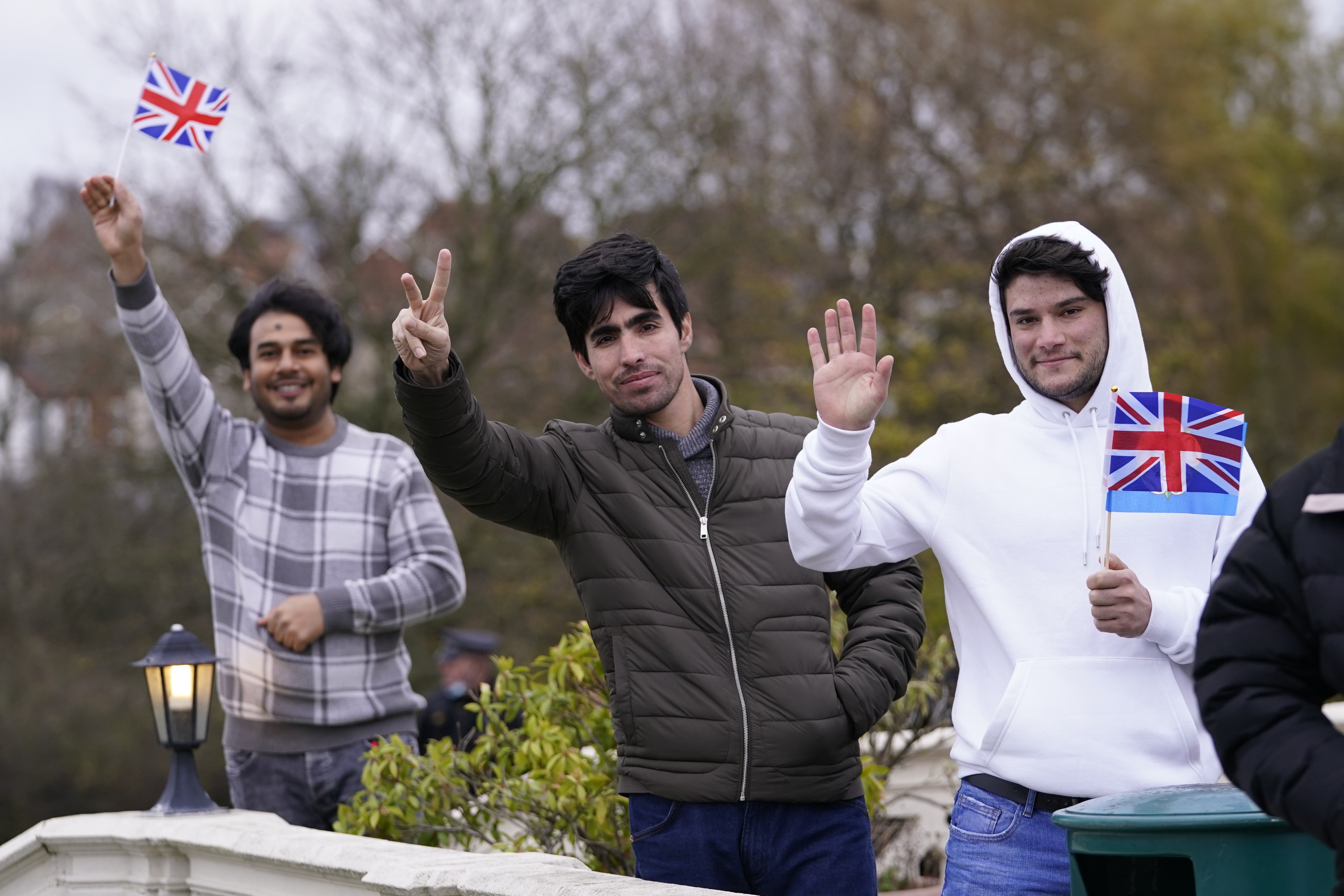 Refugees waved flags as the Duke of Cambridge left the hotel in Leeds (Danny Lawson/PA)