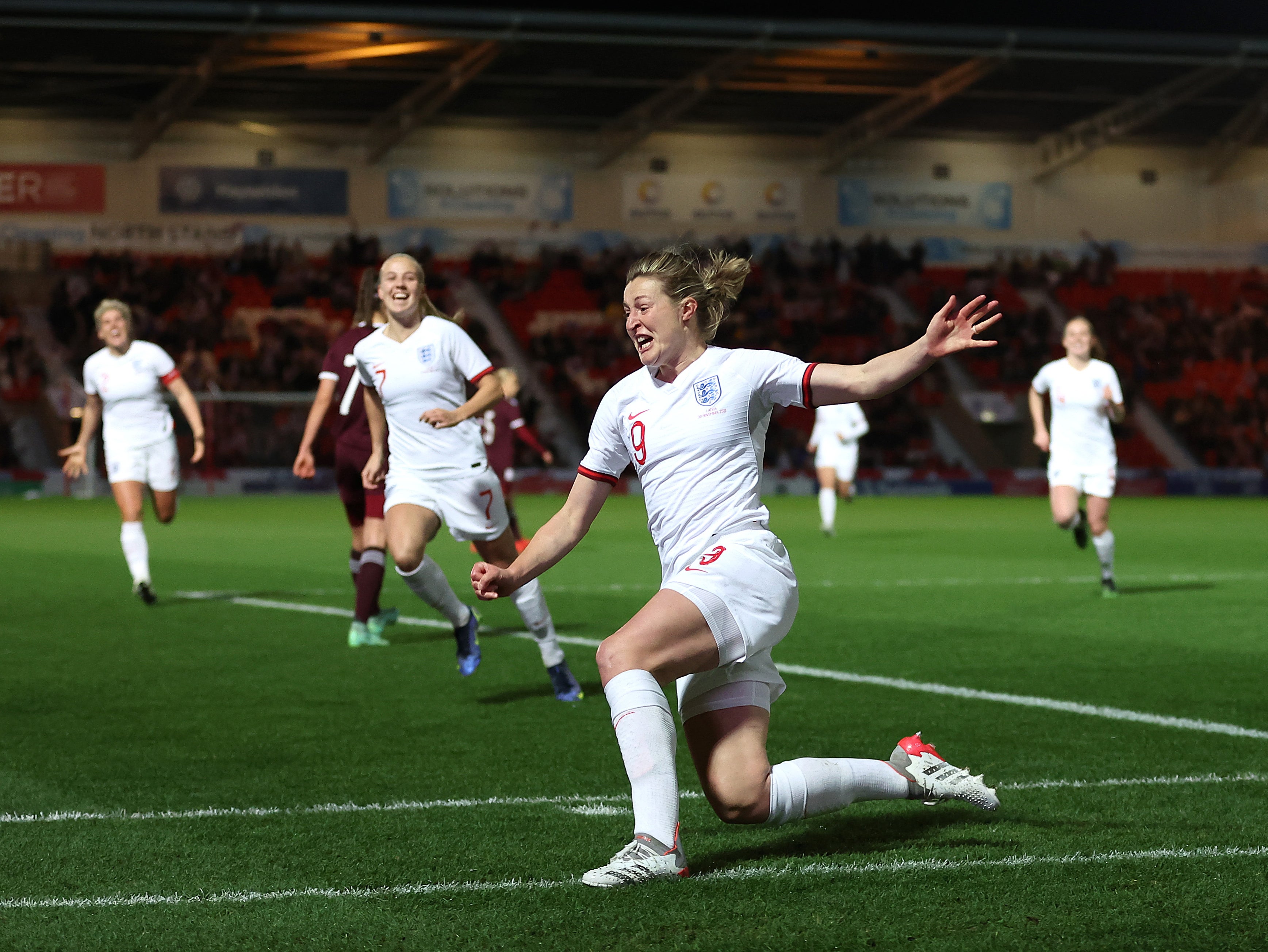 Ellen White celebrates scoring against Latvia