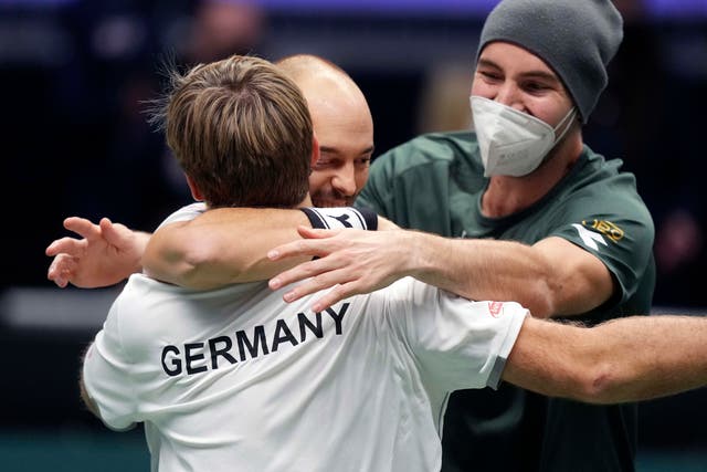 Germany’s Kevin Krawietz, Tim Puetz and Jan-Lennard Struff celebrate beating Great Britain (Michael Probst/AP)